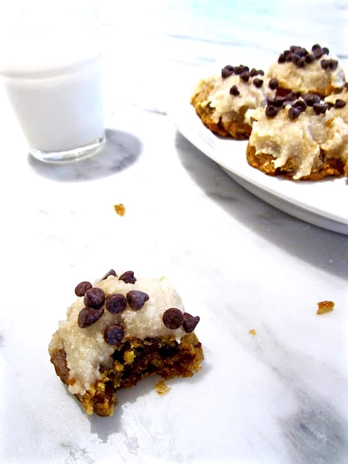 Vegan & Gluten Free Pumpkin Chocolate Chip Muffin Top Cookies with Coconut Frosting - soft baked cookies with a muffin top texture make a sweet, delightful treat for fall! Impression your non vegan and gluten free friends with this recipe. | veganchickpea.com