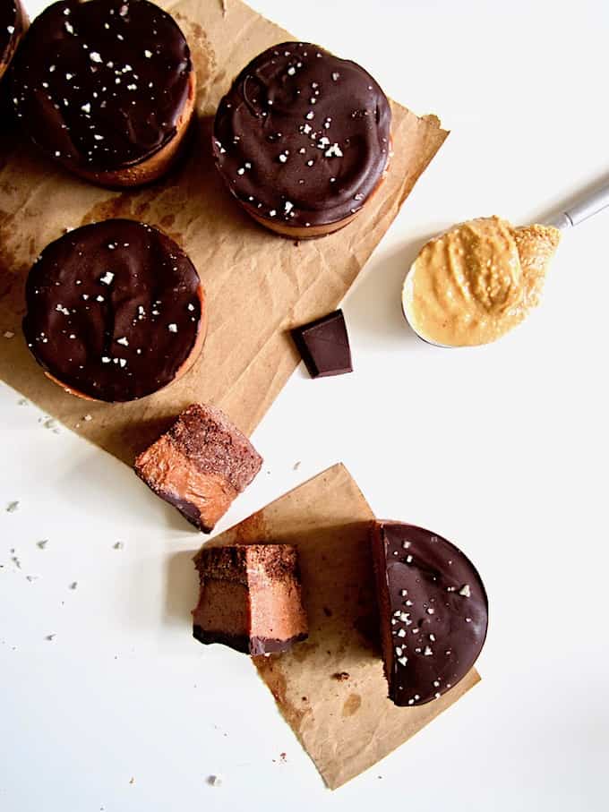  These deliciously addictive yet healthy Salted Chocolate Peanut Butter Pie Protein Cups are perfectly balanced between sweet with salty - all without any refined sugars! - and pack a protein punch with about 11 grams per serving. This easy no bake recipe will be your go-to healthy dessert or snack! {Vegan, Gluten Free + Paleo}