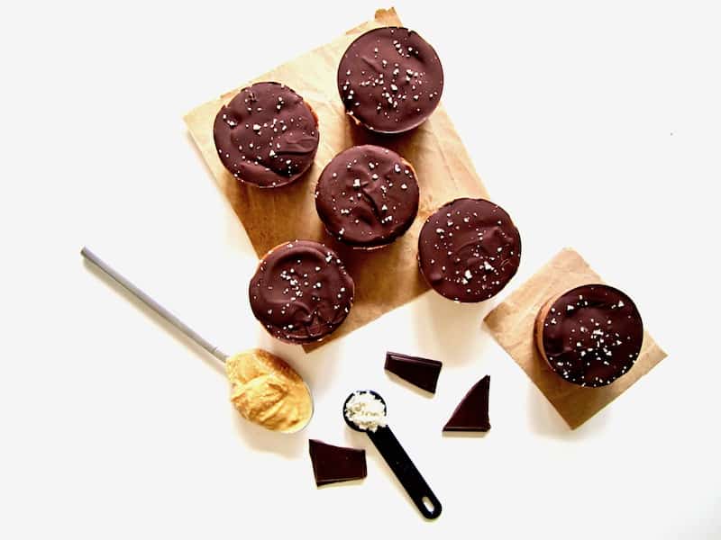  These deliciously addictive yet healthy Salted Chocolate Peanut Butter Pie Protein Cups are perfectly balanced between sweet with salty - all without any refined sugars! - and pack a protein punch with about 11 grams per serving. This easy no bake recipe will be your go-to healthy dessert or snack! {Vegan, Gluten Free + Paleo}