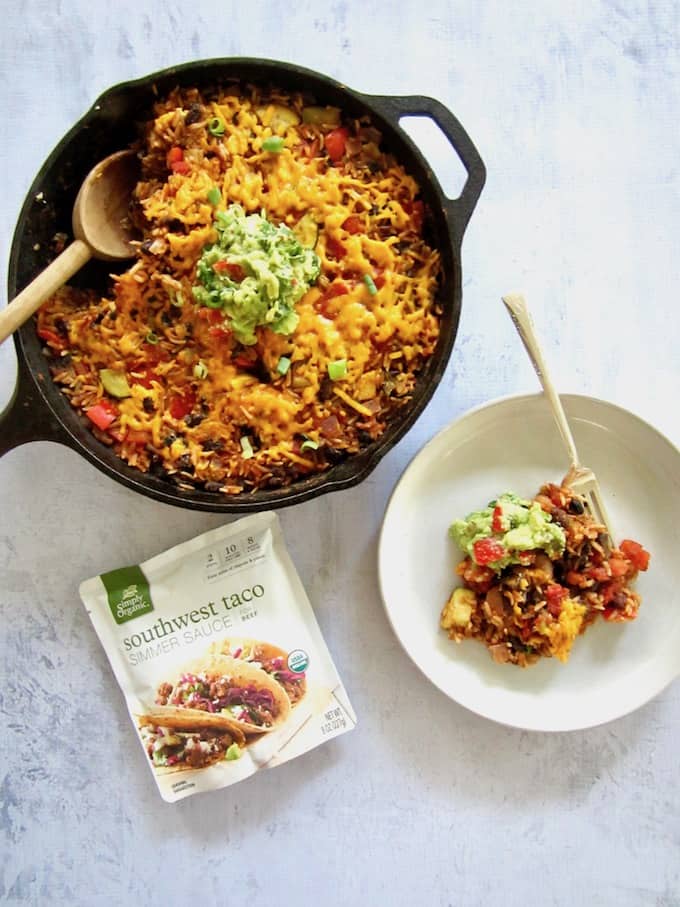 This Easy One Pan Meal: Vegan Mexican Rice Skillet (gluten free!) is a great weeknight dinner side or main meal. Simply toss rice, black beans, diced tomatoes, Simply Organic Simmer Sauce and some veggies in a skillet and let simmer. Minimal chopping required! | veganchickpea.com