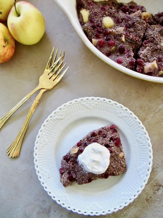 Autumn Apple & Pomegranate Chia Pudding Slice recipe - a healthy and easy breakfast or snack (12.5g of protein/slice), served warm or cold with coconut whipped cream and almond butter! Vegan, gluten free, paleo, refined sugar free with 100% sugar free and raw options! | veganchickpea.com