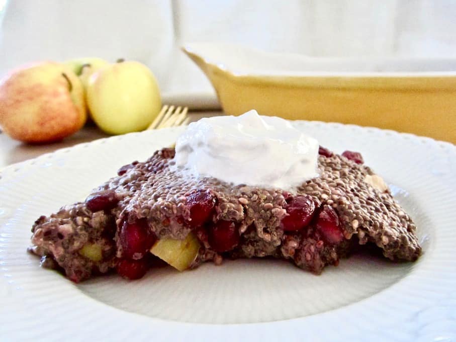 Autumn Apple & Pomegranate Chia Pudding Slice recipe - a healthy and easy breakfast or snack (12.5g of protein/slice), served warm or cold with coconut whipped cream and almond butter! Vegan, gluten free, paleo, refined sugar free with 100% sugar free and raw options! | veganchickpea.com
