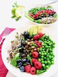 Berry, Pea & Pistachio Summer Salad + Sugar Free Mojito Dressing Recipe - Enjoy fresh seasonal produce with this colorful salad showcasing fresh raspberries, blueberries, peas and toasted pistachios over crisp greens, topped with an easy, zesty sugar free lime + mint mojito vinaigrette dressing! | Vegan, Gluten Free, Paleo | veganchickpea.com