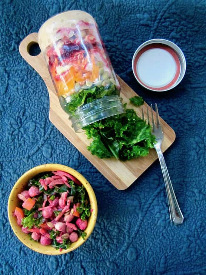 This colorful and nutritious Massaged Kale Salad is loaded with raw veggies, chickpeas and a Chili Vegan Ranch Dressing. Mason jars containers make for a convenient, grab-and-go option for an easy make ahead lunch recipe! {vegan, GF} | veganchickpea.com