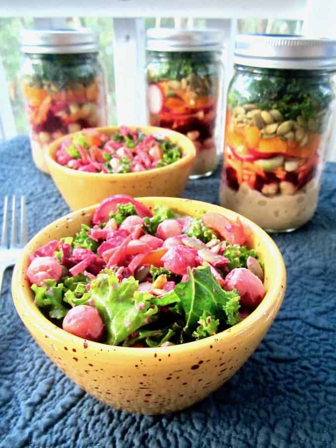 This colorful and nutritious Massaged Kale Salad is loaded with raw veggies, chickpeas and a Chili Vegan Ranch Dressing. Mason jars containers make for a convenient, grab-and-go option for an easy make ahead lunch recipe! {vegan, GF} | veganchickpea.com 