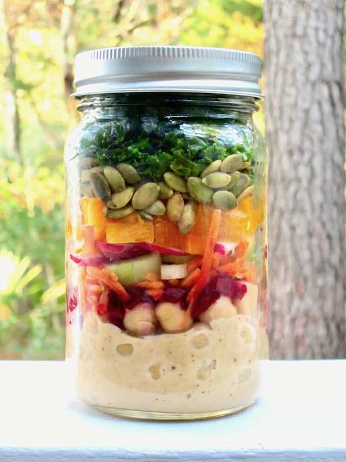 This colorful and nutritious Massaged Kale Salad is loaded with raw veggies, chickpeas and a Chili Vegan Ranch Dressing. Mason jars containers make for a convenient, grab-and-go option for an easy make ahead lunch recipe! {vegan, GF} | veganchickpea.com 