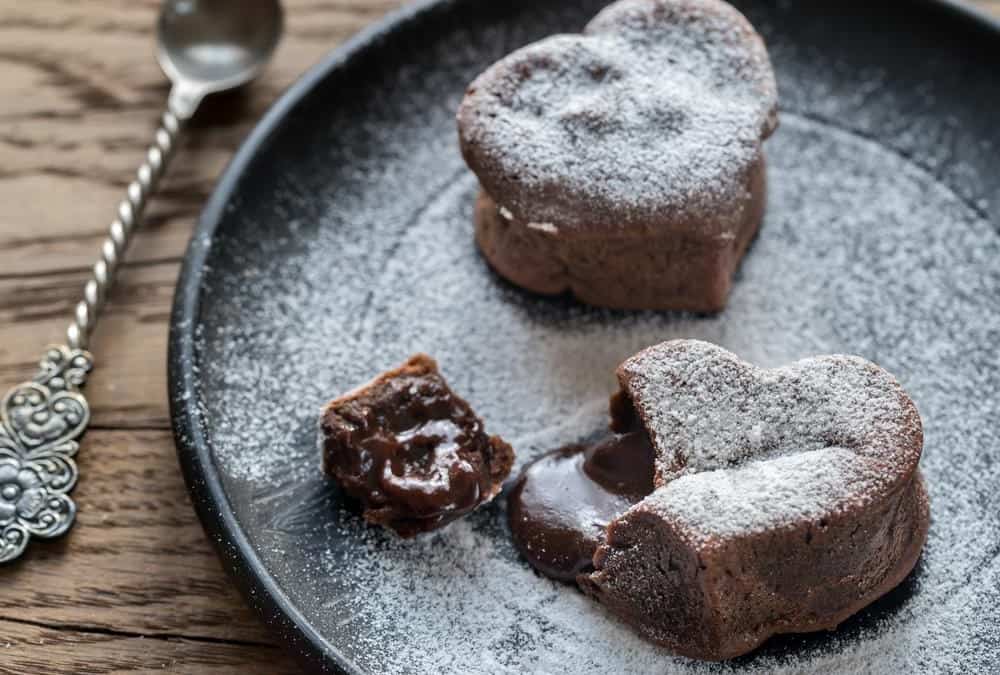 This vegan and gluten free Easy Molten Chocolate Lava Cake recipe will impress your dinner guests or special someone with their beautiful heart shape and warm gooey center! With only 10 ingredients and 30 minutes to prep and cook, you'll have a simple yet elegant dessert in no time. 