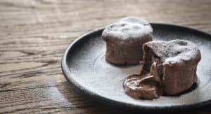 This vegan and gluten free Easy Molten Chocolate Lava Cake recipe will impress your dinner guests or special someone with their beautiful heart shape and warm gooey center! With only 10 ingredients and 30 minutes to prep and cook, you'll have a simple yet elegant dessert in no time. 
